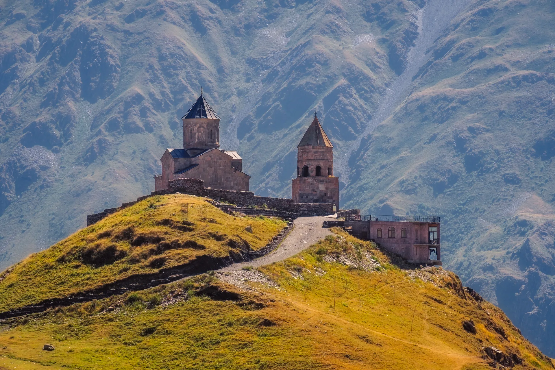 Gergeti Trinity Church with Caucasus mountains